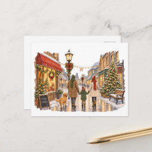 Carte Postale Famille se promenant dans une rue de Noël enneigée
