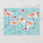 Carte postale Flamant rose Santas Blue<br><div class="desc">Un décor de Noël animé et décalé avec une touche rétro, avec des flamants roses portant des chapeaux de Père Noël, des formes géométriques crème et des étoiles sur un arrière - plan bleu (changement de couleur). Un design personnalisable pour personnaliser avec votre propre texte, images et idées. Image d'art...</div>