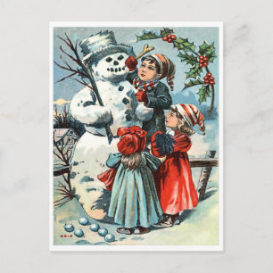 Carte Postale Garçon et deux filles faisant un bonhomme de neige