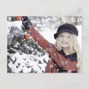 Carte Postale Happy girl decorating Christmas tree