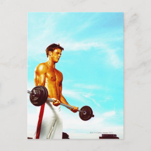 Carte Postale Jeune homme faisant de l'exercice avec des cloches