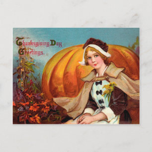 Carte Postale Jolie jeune femme avec un gros potiron de Thanksgi