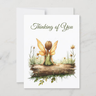 Carte Postale Lonely Fairy assis sur un journal