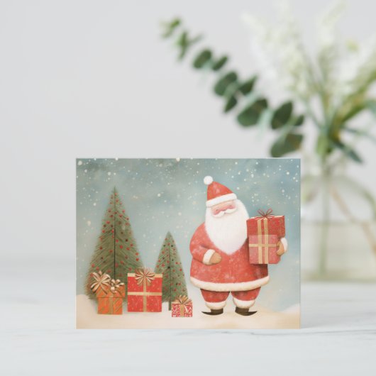 Carte Postale Père Noël fantaisiste avec sapin de Noël et cadeau (Debout devant)