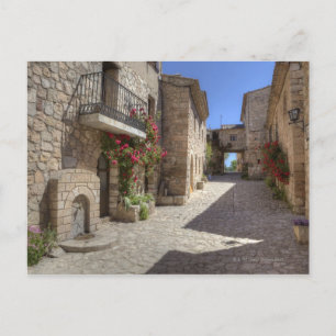 Carte Postale Rue pavée, bâtiments en pierre, historique