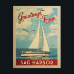 Carte Postale Sag Harbour Vintage voyage bateau à voile New York<br><div class="desc">Ce Salutations de Sag Harbour New York design nautique de voyage vintage comprend un bateau naviguant sur l'eau avec des mouettes et un ciel bleu rempli de somptueux nuages blancs bouffants.</div>