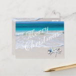 Carte postale Tropical Merry Christmas Ocean Beach<br><div class="desc">Salutation de Noël tropicale,  carte postale abordable. Customisez tout le texte avec l'océan et le sable de plage comme image arrière - plan. Économisez de l'argent avec ce type de carte.</div>