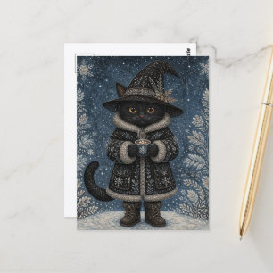 Carte Postale Un chat de sorcière noire dans la neige avec du ca