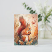 Carte Postale Un écureuil rouge qui mange une noisette (Debout devant)