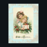 Carte postale Vintage "Un joyeux Noël"<br><div class="desc">"A Joyeux Noël" Beau dessin antique de deux magnifiques petites filles l'une en rose le deuxième en bleu. Beau Design Vintage. Beau Sentiment et Souvenirs sur une carte postale antique extraordinaire. Vous pouvez ajouter votre propre photo ou photo si vous le souhaitez.</div>