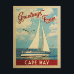 Carte Postale Vintage voyage de voilier du Cap May New Jersey<br><div class="desc">Ce Salutations From Cape May New Jersey design nautique de voyage vintage comprend un bateau naviguant sur l'eau avec des mouettes et un ciel bleu rempli de somptueux nuages blancs bouffants.</div>