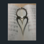 Carte Postale Wedding Ring<br><div class="desc">L'ombre mariage d'un coeur, sur un livre de musique. Parfait comme un insert RSVP. Des timbres-poste et des cartes de voeux sont disponibles. Personnaliser de l'événement.</div>