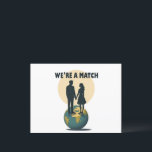 Carte Postale We're a Match: Romantic Globe-Trotting Couple<br><div class="desc">We're a Match: Romantic Globe-Trotting Couple Capture the essence of a love that spans the globe with our "We're a Match" design, featuring a silhouetted couple standing hand-in-hand atop the world. This striking illustration, set against a moonlit backdrop, symbolizes a romance that transcends borders and stands strong against all odds....</div>