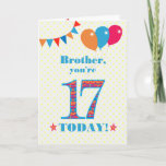 Carte Pour Brother 17th Birthday Bunting Balloons Card<br><div class="desc">Carte d'anniversaire colorée pour un frère de 17 ans, Le grand numéro 17 est rempli d'un motif orange, rouge et bleu, surligné de bleu vif. Il y a des ballons et du bunting en haut, dans des couleurs assorties et l'accueil à la couverture est : "Frère, tu as 17 ans...</div>