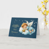 Carte Premier Noël de petit-fils ange endormi sur un nua (Fleur jaune)