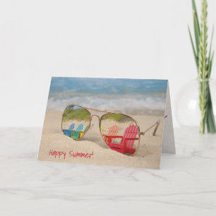 Carte réflexion de chaise de plage dans des lunettes de