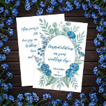 Carte Romantic Blue Fleur sauvage Mariage Félicitations<br><div class="desc">Cette élégante carte de félicitations de mariage comporte une douce couronne d'aquarelle de feuillage vert et de fleurs bleues, formant un cadre ovale délicat autour de votre message. La cursive "Félicitations pour votre jour de mariage !" ajoute une touche romantique, tandis que les noms en dessous peuvent être customisés pour...</div>
