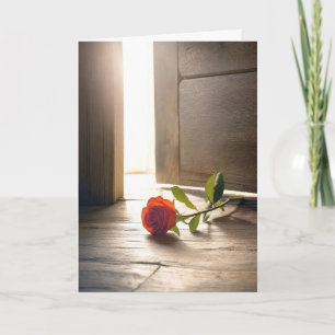 Carte Rose rouge par une porte entrouverte