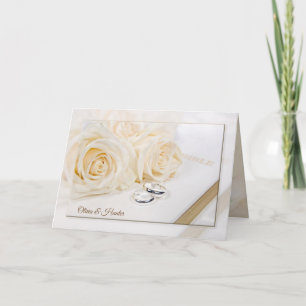 Carte roses mariages et anneaux sur la Bible blanche