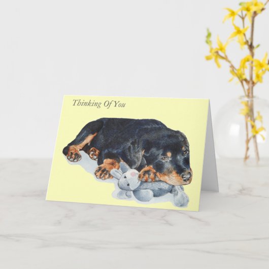 Carte rottweiler mignon de chiot avec l'ours de nounours (Fleur jaune)