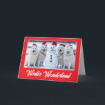 Carte Samoyeds et Snowman<br><div class="desc">Quatre Samoyeds portant des chapeaux de Père Noël posent fièrement avec un bonhomme de neige qu'ils ont construit.</div>