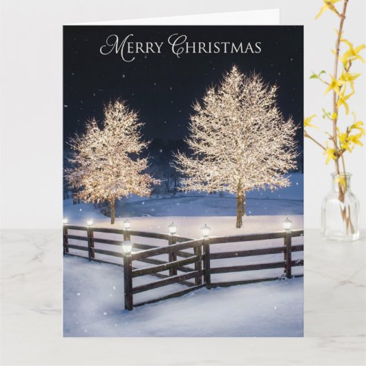 Carte Serene snowy landscape illuminated by lit trees (Fleur jaune)
