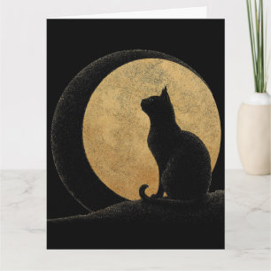 Carte Silhouette de chat noir sur une lune dorée