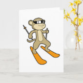 Carte Singe comme skieur avec ski (Fleur jaune)