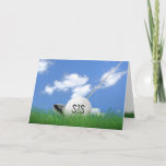 Carte Sister's birthday golf ball in grass<br><div class="desc">White golf ball in green grass with golf club and sky background for sister's birthday.</div>