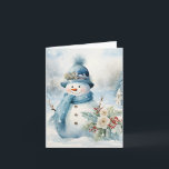 Carte Snowman Bleu Casquette Écarf Neige Arbres couverts<br><div class="desc">Adorable bonhomme de neige en bleu casquette et foulard à côté de jolies fleurs et saint en cette journée froide d'hiver.</div>