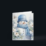 Carte Snowman mignon Casquette & Scarf Snow Arbres couve<br><div class="desc">Adorable bonhomme de neige en bleu casquette et foulard tenant de jolies fleurs blanches en cette journée froide d'hiver.</div>