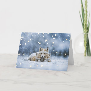 Carte Solstice d'hiver Yule avec des renards dans la nei