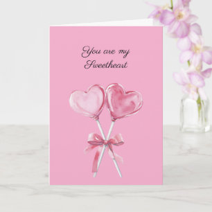 Carte Sucettes en forme de coeur rose avec amour et noeu