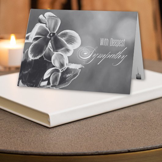 Carte Sympathie des fleurs de cyclamen et des bougies