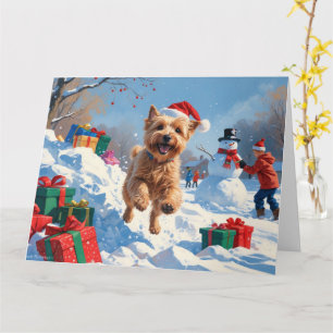 Carte Terrier Wheaten courant dans la neige avec un chap