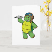 Carte Tortue en pilote avec un avion en papier (Fleur jaune)