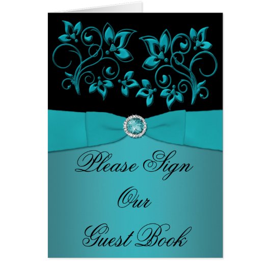 Carte turquoise et noire à la table (Devant)