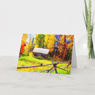 Carte Un chariot couvert dans un arrangement d'automne