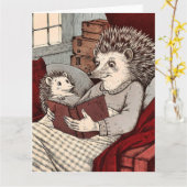 Carte Un hérisson dans une couverture lisant un livre à (Fleur jaune)