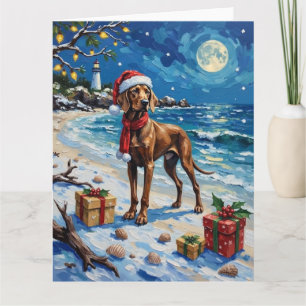 Carte Vacances de Noël sur la plage avec un Weimaraner