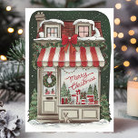 Carte Vintage Christmas Storefront<br><div class="desc">Envoyez vos voeux nostalgiques de vacances avec cette carte de vitrine de Noël magnifiquement illustrée. Le design comprend une boutique de charme ornée de décorations festives, dont un auvent rayé rouge et blanc, des couronnes, des lumières scintillantes, et des cadeaux soigneusement emballés exposés dans la fenêtre. Une scène enneigée, parfaite...</div>