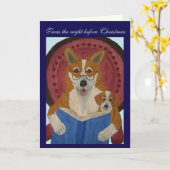 Carte Welsh Corgi lisant un conte de Noël à un chiot (Fleur jaune)