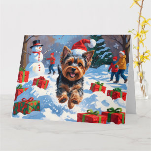 Carte Yorkshire Terrier dans la neige avec un chapeau de