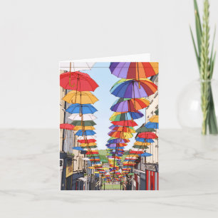 Cartes de vœux avec vue sur des parapluies colorés