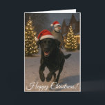 Cartes Pour Fêtes Annuelles Black Labrador and Partridge Christmas card<br><div class="desc">Humorous Christmas card featuring a Black Labrador and a Partridge in an apparent truce over the Christmas period! The Partridge is riding the Black Labrador in a snowy scene with Christmas trees twinkling in the background. You can easily personalise the text to your heart's content! Also available as an instant...</div>