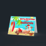 Cartes Pour Fêtes Annuelles California Christmas Père Noël et Surfboards Beach<br><div class="desc">Cette carte de voeux de Noël Joyeux présente Santa Clause sur une plage de Californie. Il se détend avec ses planches de surf, profite du soleil, des palmiers et de sa pipe. Salutation intérieure ~ "Voeux les plus chauds de notre Paradis des Vacances à votre... ". Tout le texte, sur...</div>