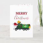 Cartes Pour Fêtes Annuelles Camion de recyclage de Noël<br><div class="desc">Un joli exemple d'un camion à ordures de recyclage de Noël portant un chapeau de Père Noël et décoré de lumières de Noël avec des mots "Joyeux Noël". Une carte de Noël idéale pour les amateurs de camions à ordures,  petits ou grands,  filles ou garçons.</div>