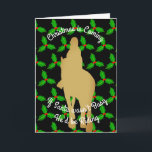 Cartes Pour Fêtes Annuelles Christmas Santa Would be Riding<br><div class="desc">Le principal élément du design est une personne riding a horse in golden silhouette set against a background of repeating holly leaves on black. The default tag-line reads,  "Christmas is Coming. If Santa Wasn't Busy He'd Be Riding" All greetings texts can easily be replaced with preferred phrases if desired.</div>