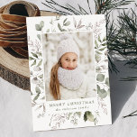 Cartes Pour Fêtes Annuelles Elegant Winter Foliage and Snowberries Photo<br><div class="desc">Elegant holiday card featuring your vertical photo framed in white with a background of watercolor snowberries, holly, eucalyptus leaves, and lush sage green foliage. Personalize the front of the botanical Christmas photo card with a custom greeting and your family name in sage green lettering. The card reverses to display your...</div>