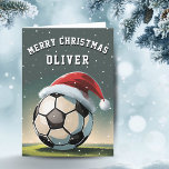 Cartes Pour Fêtes Annuelles Football Football Ball Santa Hat Joyeux Noël<br><div class="desc">Football Football Bal Santa Chapeau Nom Joyeux Carte de Noël. Le design a un ballon de football avec un chapeau de Père Noël rouge. Personnalisez avec votre nom. Vous pouvez modifier le texte Joyeux Noël.</div>